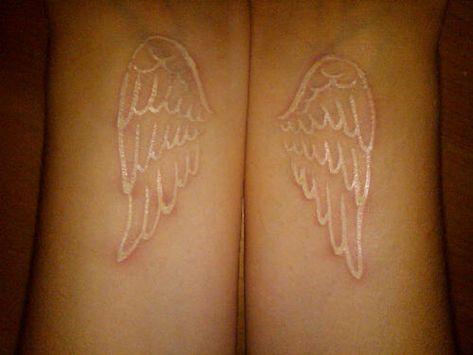 14 White ink wing tattoo Lace Tattoo White, Wing Tattoos On Wrist, Love Life Tattoo, White Ink Tattoos, Run And Not Grow Weary, Black Light Tattoo, White Ink Tattoo, White Angel Wings, Wings Like Eagles