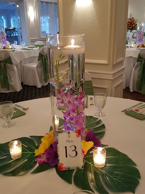 Tropical Floating Candle Centerpiece, Tropical Centrepiece, Luau Party Center Piece Ideas, Aloha Centerpieces Hawaiian Luau, Luau Table Centerpieces, Hawaiian Flower Arrangements For Tables, Caribbean Centerpiece Ideas, Plumeria Centerpiece, Hawaiian Theme Quinceanera