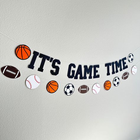 Prepare to be delighted, these sports themed decorations are the perfect addition to your party decor!  >>OPTIONS<< > It's Game Time: Will include the phrase "IT'S GAME TIME" along with 2 sports balls.  Measures approximately 4' long and is adjustable by sliding the items on the string. > Custom Sign (with number of letters): Will contain your custom message along with 2 balls. Please be sure to write a personalization with the message you would like.  Select the TOTAL number of letters in your Sport Decorations Ideas Party, All Star Party Theme Sports, Sports Week Decoration Ideas, Sports Birthday Party Games, Sport Party Ideas, Sports Themed Birthday Party Ideas, Sports Birthday Party Decorations, Sports Day Decoration, Time Decorations