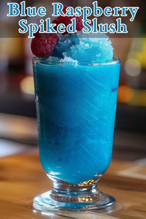 Blue Raspberry Spiked Slush is a refreshing and vibrant cocktail perfect for cooling down on a hot day. This icy drink combines raspberry vodka, blue curaçao, lemon juice, and simple syrup, blended with ice to create a frosty treat that’s as visually appealing as it is delicious. Raspberry Drink Recipes, Vodka Slush Recipe, Raspberry Vodka Drinks, Slushy Alcohol Drinks, Alcoholic Slush Recipes, Alcoholic Slush, Alcoholic Slushies, Vodka Slushies, Vodka Slush