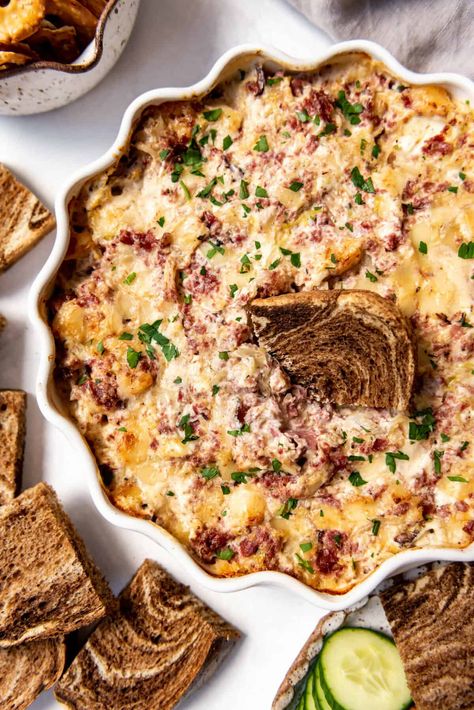 All the flavors of a classic Reuben sandwich are present in this delicious Hot Reuben Dip that is perfect for Game Day or your next party. Scoop it up with rye crackers or chunks of marble rye bread or veggies and enjoy! #reubendip #dip #appetizer #partyfood #gameday #reubensandwich #reubens Crockpot Reuben Dip, Hot Reuben Dip, Marble Rye Bread, Reuben Dip Recipe, Classic Reuben Sandwich, Rye Crackers, Dip Recipes Crockpot, Reuben Sandwich Recipe, Reuben Sandwich Classic