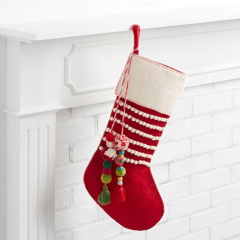 Red Felted Wool Christmas Stocking with Pom Pom Tassels by World Market Tassel Christmas, Holiday World, Gingerbread Village, Felt Stocking, Cost Plus World Market, Christmas Mantels, Christmas Villages, Red Felt, Fair Isle Knitting