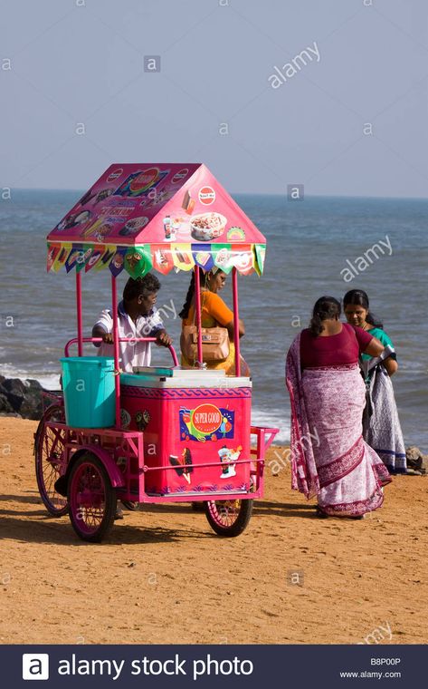 Download this stock image: India Pondicherry Goubert Avenue Beach Road Ice cream vendor with colourful cart on seafront looking at women - B8P00P from Alamy's library of millions of high resolution stock photos, illustrations and vectors. Ice Cream Vendor, Indian Ice Cream, Ice Cream Beach, Figure Sketches, Beach Cart, Human Figure Sketches, Ice Cream Cart, Juicer Machine, Henna Party