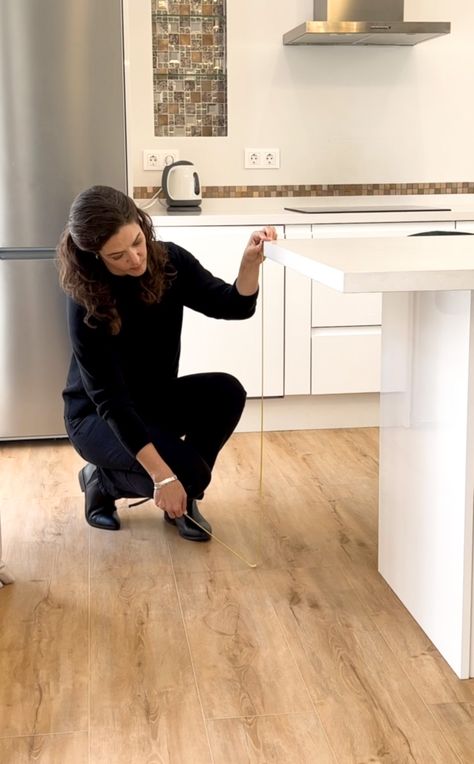 woman with ruler measuring kitchen island height and measurements layout Kitchen Island Measurements Layout Modern, Kitchen Island Measurements Layout, Kitchen Island Drawers Layout, Kitchen Countertop Height, Kitchen Island Measurements, Island Height, Kitchen Island Height, Countertop Height, Island Drawers