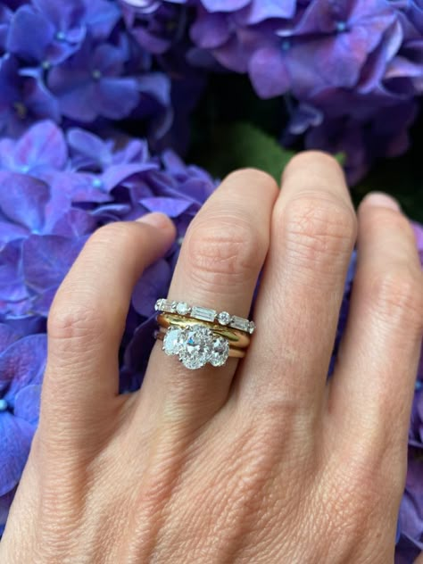 In love with this stacking ring combination 🌟 Trilogy oval diamond ring with our sifnature D shaped wedding band and a round and baguette eternity band 👀 #Sophiebreitmeyer #oneofakind #bespoke #Modernfamilyjeweller #SBwedding #finejewelery #diamond Bands For Three Stone Rings, Three Stone Ring With Band, Oval Diamond Ring With Baguettes, Wedding Band With Trilogy Ring, 3 Stone Engagement Rings With Wedding Band, Three Ring Stack, Oval Trilogy Engagement Ring With Wedding Band, Three Stone Wedding Band, Mixed Stone Wedding Band