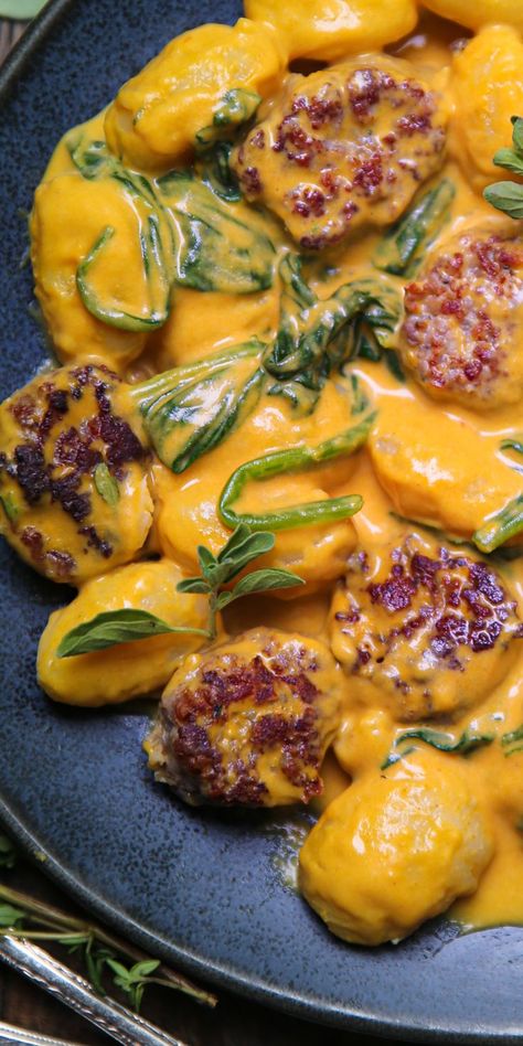 Creamy Pumpkin Gnocchi with Spinach and Sausage on a blue plate. Creamy Pumpkin Gnocchi, Recipes With Pumpkin Gnocchi, Pumpkin Gnocchi Recipes, Gnocchi With Spinach, Squash Gnocchi, Pumpkin Sausage, Simple Spinach Salad, Dinner Recepies, Pumpkin Gnocchi