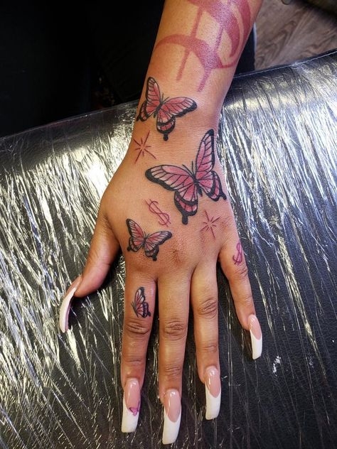 Tattoos Aesthetic Black Women, Pink Tattoos On Black Women, Red Butterfly Hand Tattoo For Women, Hottie Tattoo Ideas, Red Hand Tattoo Black Women, Red Butterfly Hand Tattoo, Red Sternum Tattoo Black Women, Raw Tattoos For Women, Red Tattoo On Black Women Dark Skin