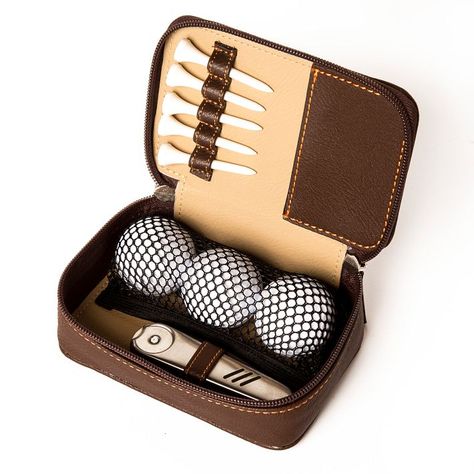 Designed with the aspiring pro or weekend golfer in mind, this compact zippered set makes storing and carrying essentials a breeze. It arrives packed with three balls, five tees and a handy hinged multi-tool that includes a divot repairer, ball marker and groove cleaner. All these zip up securely in a faux leather, easy-to-clean case that can join you anywhere out on the green. A foil debossed monogram makes it a thoughtful gift.    5.75"w x 3.75"d x 2"h  Vegan leather, stainless steel, plastic.  Imported.  Monogramming is foil debossed.     Ships directly from the designer without Mark & Graham signature gift wrap. Men’s Gifts, Manly Gifts, Golf Essentials, Giveaway Ideas, Golf Gifts For Men, Leather Store, Groomsmen Proposal, Gifts For Golfers, Mini Golf