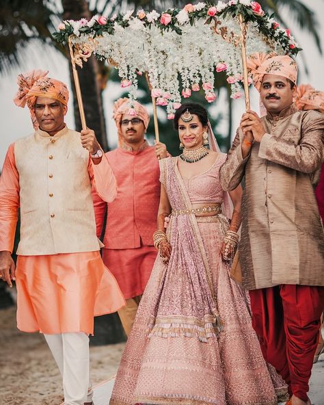 A simple yet beautiful way to enter your wedding with your loved ones under an umbrella phoolon ki chaadar. #shaadisaga #bride #bridal #bridalentry #wedding #weddingentry #bestbridalentryidea #phoolonkichaadar #weddingentryidea #bridalentryideas #weddinginspo #weddinginspiration Bridal Entry, Sabyasachi Bridal, Bride Entry, Sabyasachi Bride, Desi Wedding Decor, Desi Bride, Indian Bridal Lehenga, Beautiful Beach Wedding, Indian Wedding Planning