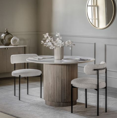 Offering a modern classic look, this stunning Ravenna Round Dining Table, White Marble Top, Mango Wood Base exudes timeless quality and beauty. It is crafted from solid mango wood, with a striking vertical ribbed feature on the drum base, and a polished Indian white Carrera marble top with classic grey/blue veins running through it. Matching pieces available. Click Here To Shop The Complete Collection Dimensions: (w)1100mm x (d)1100mm x (h)750mm Colour: Grey Wash / White Materials: Mango Wood, M White Round Dining Table, Mango Wood Dining Table, Blue Veins, Round Marble Dining Table, Marble Top Dining Table, Carrera Marble, Classic Grey, Solid Mango Wood, Table Seating