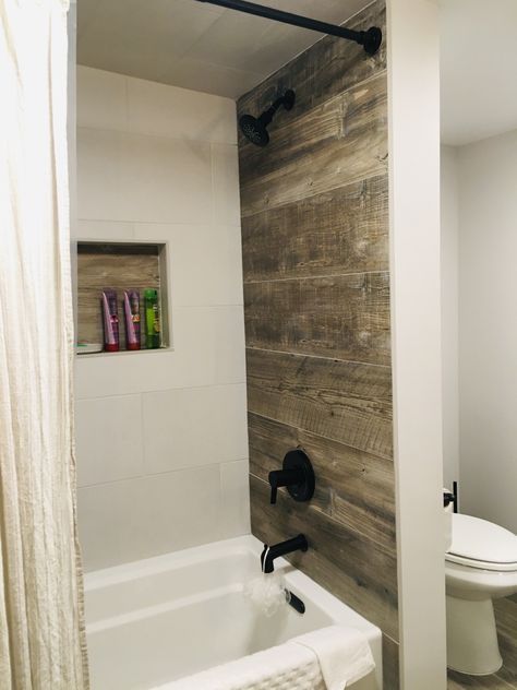 Wood Tile Bathtub Surround, Faux Wood Tile Shower Walls, Wood Tile Tub Surround, Wood Tile Bathtub, Wood Tile Shower Wall, Bathroom With Wood Tile, Bath Tile Ideas Tub Surround, Wood Shower Walls, Wood Tile Shower Ideas