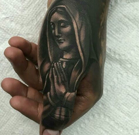 black and grey virgin Mary hand tattoo Virgen Mary Tattoo, Thumb Tattoo, Payasa Tattoo, Bullet Tattoo, Lowrider Tattoo, Cover Up Tattoos For Men, Thumb Tattoos, Inca Tattoo, American Indian Tattoos