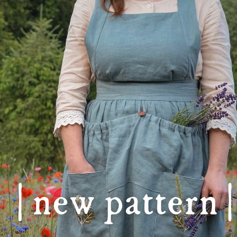 The | NEW | Wildflower Pinafore is a timeless layering piece for all seasons.   Slip it over a blouse or dress and be transported to simpler, slower time. A little bit vintage and romantic, but also practical for play or chores - after all, pinafores are meant to protect the "good" clothes underneath.   Whether wandering in wildflowers or baking bread in the kitchen, a pinafore adds a generous dash of charm and practicality to any outfit.   Click to learn more about the PDF pattern 🌿 Apron Dress Pattern Free, Pinafore Apron Pattern Free, Twig And Tale, Pinafore Apron Pattern, Apron Dress Pattern, Pinafore Sewing Pattern, Kitchen Sewing, Apron Pattern Free, Pinafore Pattern