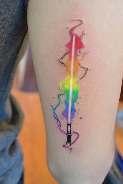 Wand And Lightsaber Tattoo, Flower Lightsaber Tattoo, Nerdy Matching Tattoos, Purple Lightsaber Tattoo, Lightsaber Tattoo Minimalist, Lightsaber Tattoos, Deconstructed Lightsaber Tattoo, Small Star Wars Tattoo, Nerd Tattoo Ideas