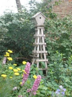 Bird Feeder Stands, Obelisk Trellis, Trellis Garden, Wooden Birdhouse, Garden Birdhouses, Garden Obelisk, Lounge Space, Garden Vines, Comfortable Lounge