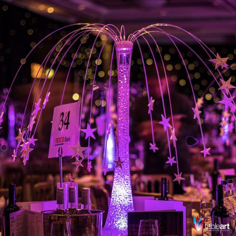 Under a canopy of Stars, guests will feel transported as they look up to the night sky. The Star Fountain table centre adds an ethereal beauty to any event. Under The Stars Quinceanera Theme, Starry Night Prom, Night To Shine, Centre Table Design, Glow Table, Sweet 16 Centerpieces, Star Centerpieces, Galaxy Wedding, Lily Vases