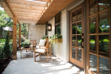 The Severns wanted this home to have easy access to their front porch patio from almost anywhere in the home. We added three sets of doors to the front of this house to give them the indoor/outdoor feeling they were looking for. Colonial Cottage, Cottage Outdoor, Primitive Homes, Wooden Pergola, Pergola Ideas, Front Patio, Pergola Plans, Pergola Patio, Pergola Designs