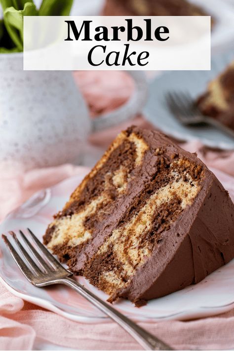 This homemade marble cake rivals any bakery and is incredibly easy to make. With just 15 minutes of prep time, this cake pairs vanilla and chocolate cake in a gorgeous swirl that is sure to impress and tastes as good as it looks. Best Marble Cake Recipe, Homemade Marble Cake, Vanilla And Chocolate Cake, Marble Cake Recipe, Chocolate And Vanilla Cake, Cookie Cookbook, Bakery Style Muffins, Swirl Cake, Cake Plates Stand