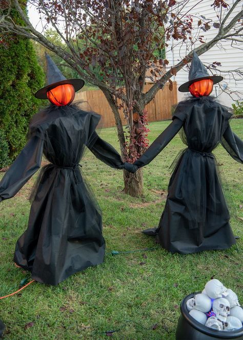 Add some spirit by building these DIY Halloween witches. Made with easy to find supplies and glowing heads! They are life sized, easy to store, and no-sew. Includes step by step instructions and video. Halloween Outside Decorations Diy Witches, Diy Outdoor Halloween Witches, Halloween Witch Theme Outdoor, How To Make Outdoor Halloween Witches, Witch Decor Outside, Halloween Diy Witch, Witch Theme Halloween Decor Outside, Halloween Witches Diy, Witches Diy