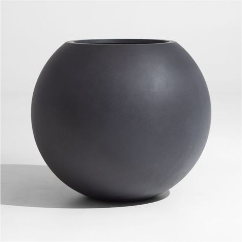 Add modern geometry to outdoor spaces with this sculptural large round planter in garden-friendly grey.  Looking as if it were crafted from concrete, the planter is made of a lightweight mix of fiberglass, cement and sand, making it easy to position.Fiberglass, cement and sandDrainage hole with removable rubber stopperFor indoor or outdoor useProtect from freezing temperaturesMade in Vietnam Room Blueprint, Entry Courtyard, Round Planters, Organization Office, Tree Pot, Garden 2023, Sphere Light, Garden Spheres, Plant Lights