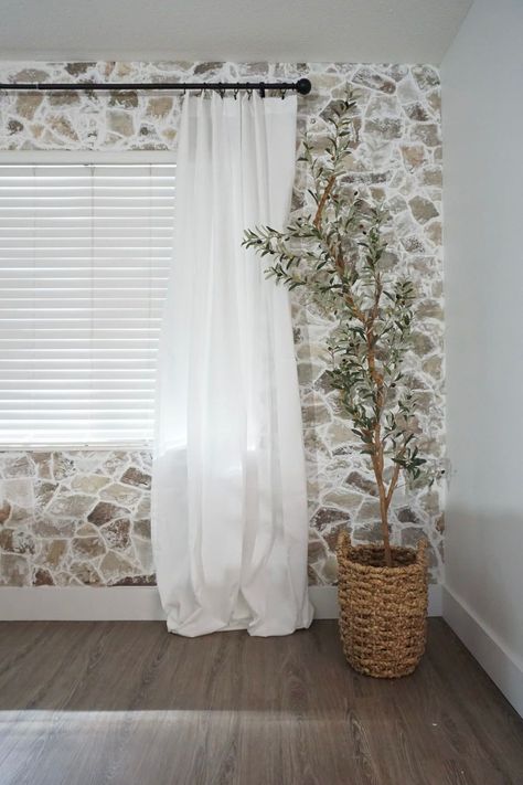 Want to create your own DIY faux stone wall in your home? Here we share how we created this unique accent wall to bring texture to our Living Room Transformation. For more interior design ideas and DIY home projects please visit us at https://mrsashleyfrench.com/! Interior Faux Stone Wall, Diy Stone Wall Interior, Faux Stone Wall Interior, Fake Stone Wall, Diy Stone Wall, Easy Home Upgrades, Modern Traditional Home, Faux Stone Walls, Stone Walls Interior