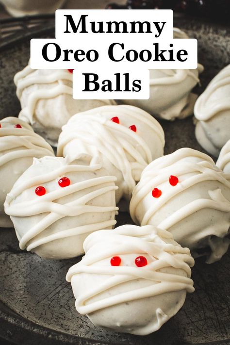 Irresistible and rich, these spooktacular Mummy Oreo Cookie Balls are a wickedly good Halloween treat and are easy to make. Coated in vanilla almond bark and filled with cream cheese and crushed Oreos they're perfect for a party, especially a Halloween charcuterie board. Oreo Mummy Cookies, Black Widow Cocktail, Black Widow Halloween, Halloween Dinner Party Food, Egg Breakfast Casserole, Oreo Cookie Balls, Halloween Charcuterie, Cream Cheese Ball, Cookie Balls