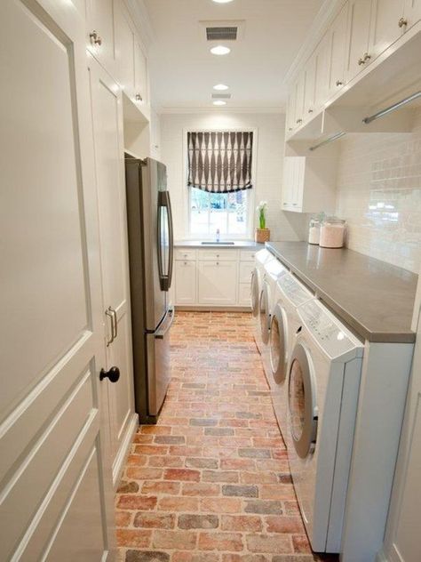 From homedit Exposed brick is also a great option for floors! These floors pop when paired with white cabinets in this gorgeous laundry room. Brick Floors, Traditional Laundry Room, Mudroom Storage, Chicago Brick, Laundry Room/mud Room, Pantry Laundry, Stylish Laundry Room, Dream Laundry Room, Mud Rooms