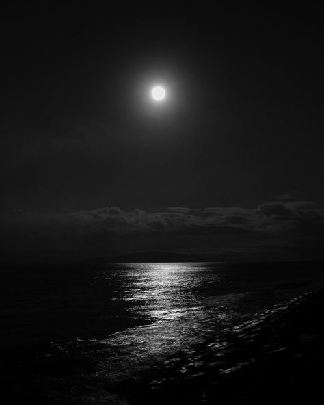 "Print Title - Moon Glow Introducing \"Moon Glow,\" a black and white photographic artwork capturing the captivating beauty of a full moon night in Maui, Hawaii. Taken from the rocky shoreline of Kalama Park, Maui, this artwork immortalizes the moon's ethereal glow reflecting over the ocean, guiding the viewer's gaze towards the distant island of Lanai. Presented in classic black and white, the image emits a modern romantic sensibility, transforming any space into a serene oasis. Ideal for sparking conversations, \"Moon Glow\" will surely become a cherished addition to your decor. Key Details ◦ Modern black and white full moon artwork photograph ◦ Premium archival lustre paper ensures lasting quality ◦ Sizes: 8x10, 11x14, 16x20, 20x24, 24x30, 40x50 ◦ Comes unmatted, ready for your personal Black Night Sky Aesthetic, Black Aesthetic Moon, Tv Screen Aesthetic, Black Ethereal Aesthetic, Asthetic Picture Dark, Black Aesthetic Images, Black Pictures Aesthetic, Black Asthetics Photos, Soft Black Aesthetic