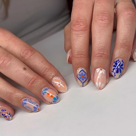 Channeling the vibrant spirit of Mexican pottery with these intricate nail designs. Each pattern tells a story, bringing a touch of culture and artistry to your fingertips. 🌸✨ #MexicanPottery #NailArt #HandPaintedNails #CulturalBeauty #NailInspo #ArtisticNails #BrightAndBold #NailDesign #NailTech #ColorfulNails @lianakorber Oaxaca Nails, Mexican Pattern Nails, Mexican Embroidery Nails, Hispanic Nails Designs, Mexican Tile Nails, Mexican Pottery Nails, Intricate Nail Designs, Mexico Nails, Mexican Nails