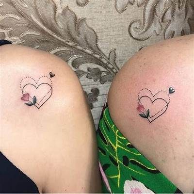 Cherish the Bond: 24 Unique Small Mother Daughter Tattoo Designs - Symbolize Your Unbreakable Connection Mother Daughter Tattoos Shoulder, Tattoos Ideas For Daughter, Mother Daughter Shoulder Tattoos, Mum And 2 Daughters Tattoo, Mother Daughter Rose Tattoos, Mother Daughter Small Tattoos, Like Mother Like Daughter Tattoo, Mum Daughter Tattoo, Butterfly Tattoos With Flowers