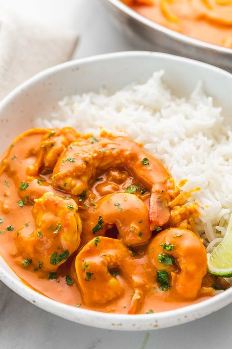 This one-pan coconut shrimp curry is made with a creamy and aromatic coconut curry sauce made from scratch. This delicious dinner is so easy and ready in no time! Serve over steamy rice, homemade naan bread, and wedges of fresh lime. Homemade Coconut Curry, Shrimp And Potato Curry, Easy Coconut Curry Shrimp, Seafood Coconut Curry, Creamy Prawn Curry, Curried Prawns And Rice, Shrimp Coconut Curry Recipe, Coconut Shrimp With Rice, Coconut Shrimp Curry Indian