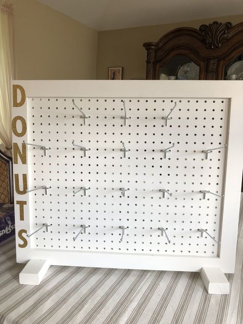 Donut wall made from peg board. Peg Board For Jewelry Display, Peg Board Table Display, Pegboard Jewelry Display Diy, Diy Standing Pegboard Display, Peg Board Keychain Display, Pegboard Keychain Display, Scrunchie Board Display, Peg Board Craft Show Display, Table Top Pegboard Display