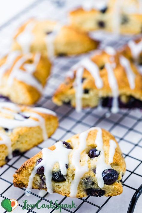 Learn how to make dairy-free (paleo!) keto blueberry scones recipe that is perfect for a quick breakfast or snack. Enjoy these moist scones with juicy blueberries that are topped with a sugar-free exquisite lemon glaze. Their texture is fantastic: crispy edges, soft, tender and buttery - melt-in-your-mouth scones. Keto Scones Recipe, Keto Blueberry Scones, Keto Scones, Blueberry Scones Recipe, Keto Blueberry, Scones Ingredients, Low Carb Fruit, Blueberry Bread, Scones Recipe