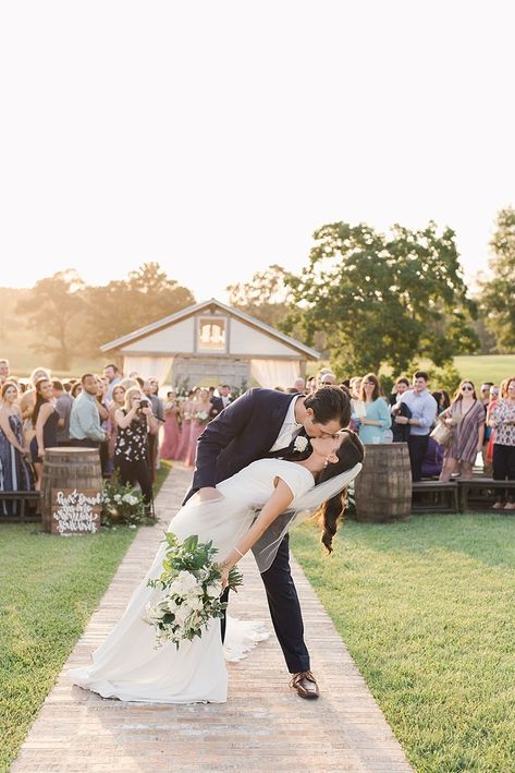 It's always a good idea to stop and kiss your bride as you exit the ceremony. This groom decided to go for the dip, and it was perfect! The sunset was stunning during this Thibodaux, Louisiana wedding ceremony at the White Magnolia. For more information on this wedding venue, more summer wedding inspo, or info on our photography services, go to www.peonyphotography.com Wedding Ceremony Dip Kiss, Thibodaux Louisiana, Dip Kiss, Peony Photography, Grooms Suits, Ceremony Exit, Magnolia Wedding, Louisiana Wedding, Romantic Wedding Photography