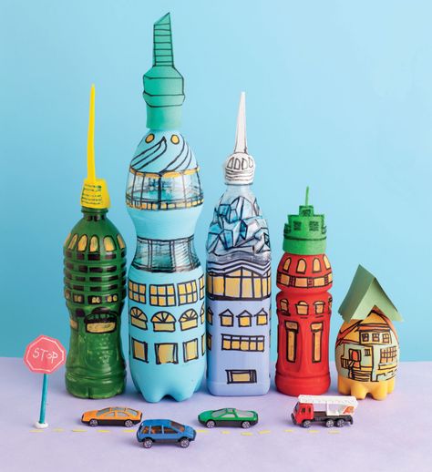 These “buildings” are made from plastic bottles, glue, paint, and colored paper. Recycled Crafts Kids Projects, Plastic Bottle House, Recycled Crafts Kids, Bottle House, Diy Plastic Bottle, Recycled Art Projects, Craft Kids, Plastic Bottle Crafts, Plastic Crafts