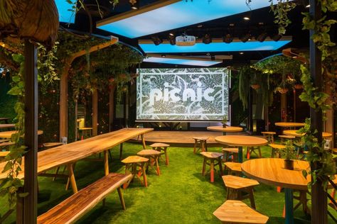 Picnic - Singapores garden themed food truck court Picnic Restaurant Design, Food Truck Courtyard, Garden Themed Restaurant, Food Truck Court, Garden Theme Restaurant, Food Truck Outdoor Seating Ideas, Garden Themed Food, Wildfire Project, Food Court Design Outdoor