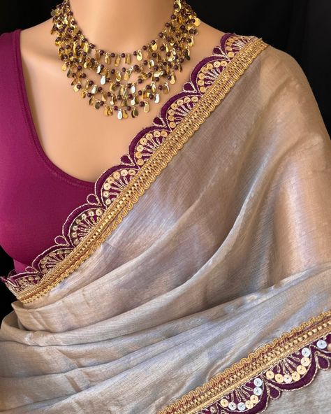 Silver mettalic tissue saree with contrast magenta golden lace all over sarees. Comes with beautiful big magenta thread tassels on pallu. Blouse: running blouse 80cm. To find this product in website: Www.thejacouture > Tissue sarees> silver mettalic tissue saree. Jewellery collaboration: @anvi__jewellery #mettalictissuesaree #silversaree #fancysaree #tissuesaree #trendingsaree #tissuelacesaree Magenta Saree Contrast Blouse, Silver Saree With Contrast Blouse, Golden Saree With Contrast Blouse, Silver Tissue Saree, Golden Blouse Designs, Blouse Back Designs, Bride Sarees, Soft Saree, Latest Blouse Neck Designs