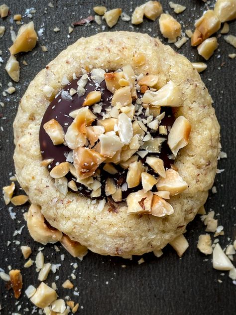 Chocolate hazelnut thumbprint cookies Hazelnut Thumbprint Cookies, Chocolate Hazelnut Thumbprint Cookies, Hazelnut Cookies Recipes, Cookies Lebaran, Nutty Cookies, Cranberry Cheesecake Bars, Chocolate Caramel Slice, Chocolate Hazelnut Cookies, Bakery Aesthetic