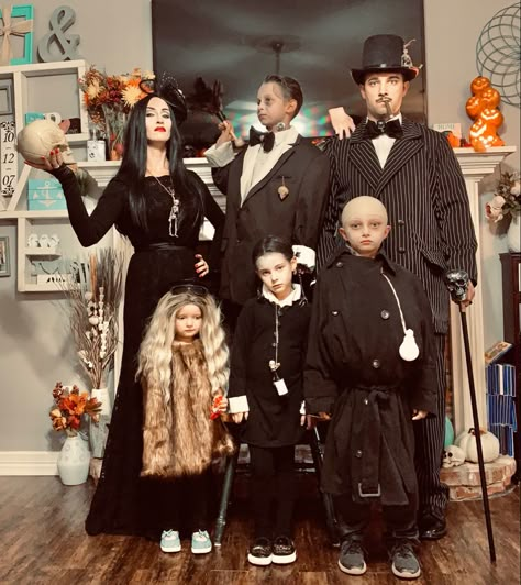 Addams Family halloween costumes. Actually the Roessner’s! Hand made halloween costumes from finds at good will. DIY Costume ideas every year from the Roessner family of 6. Mom sews all the costumes! What will they think of next? Amazing halloween costume ideas. Morticia, Gomez, Uncle Fester, Lurch, Wednesday, Cousin It. All makeup done by Mom Emily as well. Awesome group of people Adams Family Costume Family Of 5, Scary Halloween Costume Ideas Group, Family Of 4 Costumes Halloween, Diy Addams Family Costume, Family 6 Halloween Costumes, Lurch Costume Diy, Wednesday Family Costume, Wednesday Addams Mom, Halloween Family Custom Ideas