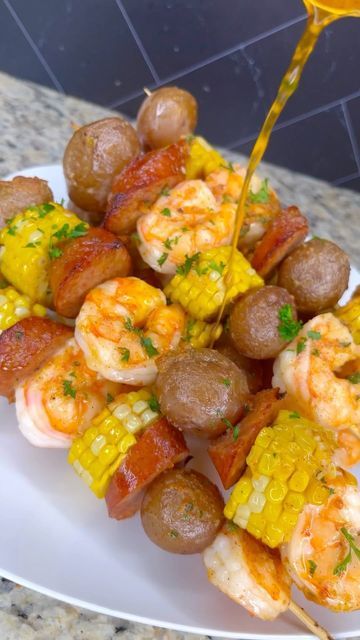 Bri’s Heat 🔥💕 on Instagram: "I’ve been wanting to try these seafood boil kabobs and they were everything I thought they would be🤤 What y’all think? Full recipe on my YouTube channel, click the link on my page to get there. • • • • • • • • • • • #seafoodboil #shrimpboil #shrimp #corn #kabob #easyrecipes #quickrecipes #dinner #grilling #garlicbutter #cajun #shrimprecipes #shrimpkabobs #explore #explorepage✨ #stlfoodscene #stlfoodie #chicagofood #tasty #tastyfood #foodreels #foodie #foodblogger" Seafood Party Ideas For Birthday, Seafood Charcuterie Board Ideas, Seafood Kabobs, Shrimp Corn, Seafood Dish Recipes, Seafood Boil Recipes, Bbq Menu, Delicious Seafood Recipes, Beach Food