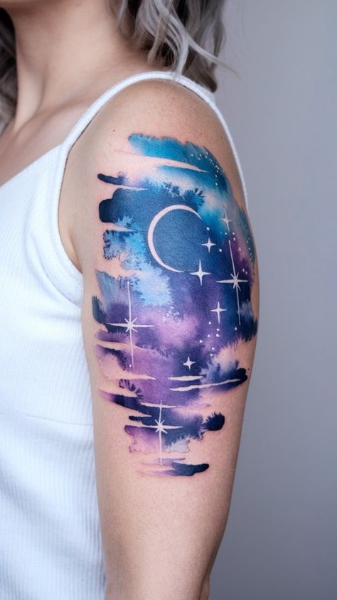 Get ready to be mesmerized by this stunning watercolor starry night sky tattoo. Perfect for those who love vibrant and colorful tattoos. #WatercolorStarryNight #TattooArt #NightSky Space Shoulder Tattoo, Night Sky Tattoos, Galaxy Tattoos, Ripped Skin Tattoo, Shooting Star Tattoo, Sky Tattoos, Rip Tattoo, Space Tattoos, Remembrance Tattoos