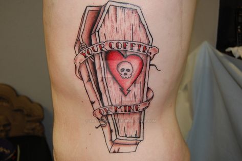 The gothic coffin tattoo makes a big statement. Learn more about its meaning, explore design options, and view lots of example photos here. Traditional Tattoo Coffin, Alkaline Trio Tattoo, Trio Tattoo Ideas, Coffin Tattoo, Alkaline Trio, Gothic Coffin, Candle Tattoo, Tattoo Meanings, Symbolic Tattoos