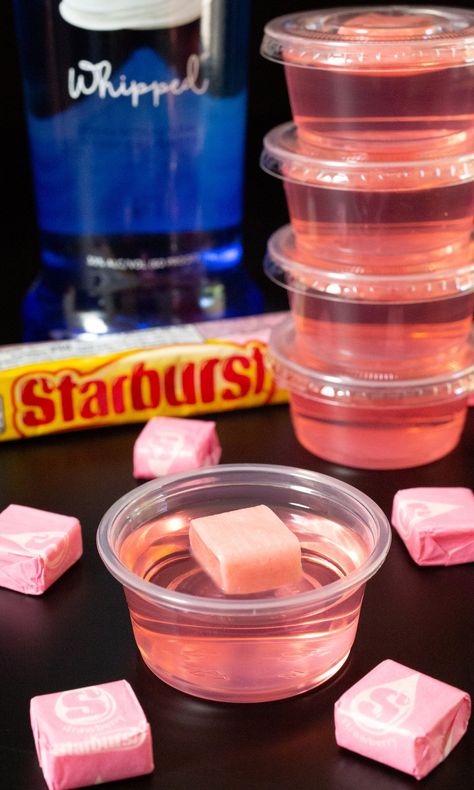 Fun and fruity strawberry flavored starburst jello shots. Their pink color is perfect for girl's nights, bachelorette parties, and gender reveals. Use whipped vodka for optimal flavor! Strawberry Starburst Jello Shots, Pink Whitney Jello Shots, Pink Jello Shots, Pink Starburst Jello Shots, Starburst Jello Shots, Strawberry Jello Shots, Strawberry Starburst, Iced Caramel Macchiato Recipe, Pink Vodka