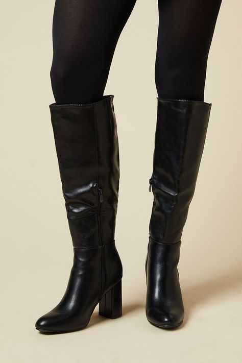 Sleek knee-high boots with almond toe design Sturdy block heel measuring between 7-9cm for comfortable elevation Smooth PU construction for a polished look Side zip closure for easy on-and-off Versatile style suitable for various outfits and occasions Step out in style with these Liliana knee-high boots from Dorothy Perkins. Perfect for the fashion-forward woman who appreciates both trend and comfort, these boots offer a chic solution for your night-out wardrobe. The almond toe and sleek silhouette create a flattering line, while the block heel provides stability without sacrificing height. Pair them with a midi dress and statement earrings for a sophisticated brunch look, or style them with skinny jeans and an oversized jumper for a casual yet put-together ensemble. These versatile boot Boots Wide, Black Tie Party, Black High Boots, Party Handbags, Trainer Heels, Oversized Jumper, Knee Boot, Smart Casual Outfit, Trending Sunglasses