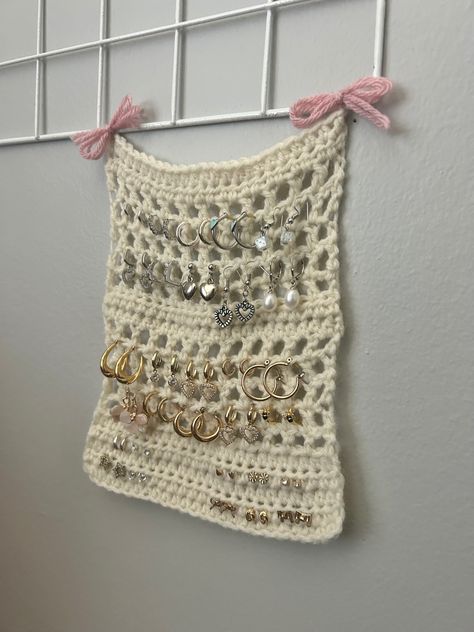 freehanded by me :) comment for a tutorial Jewellery Hanger Diy, Yarn Holder Crochet Pattern, Crochet Wall Jewelry Holder, Crochet Holder For Hooks, Crocheted Jewelry Holder, Jewellery Hanger Crochet, Knit Jewelry Holder, Crochet Home Decor Aesthetic, Crochet Jewellery Hanger