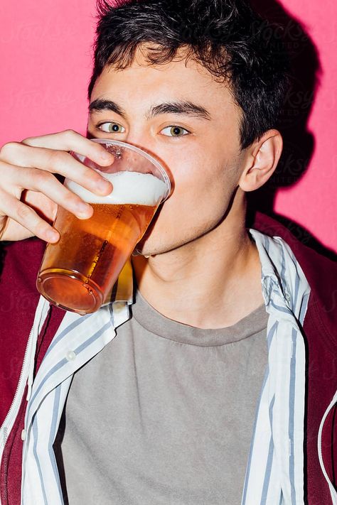 Young man drinking beer and looking at camera Person Drinking Reference, Holding Drink Reference, Drinking Pose, Man Drinking, Drink Stand, Beer Photography, Cocktail Photography, Beer Ad, Drawing Prompts