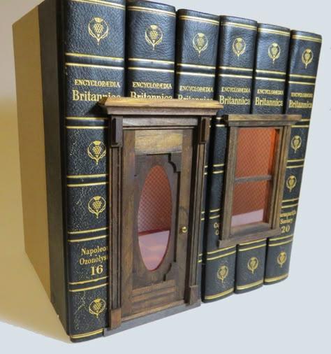 So here's something that absolutely needs a place in my cabinet of curiosities– book houses! Real books, "hollowed-out" and filled with a miniature vignette setting, complete with tiny scaled wallpaper and parquet flooring. They come from a little-known artist I found in the far corners of the net, Book Village, Miniature Buildings, Miniature Shop, Miniature Book, Cabinet Of Curiosities, Book Sculpture, Miniature Rooms, Fairy Doors, Book Folding