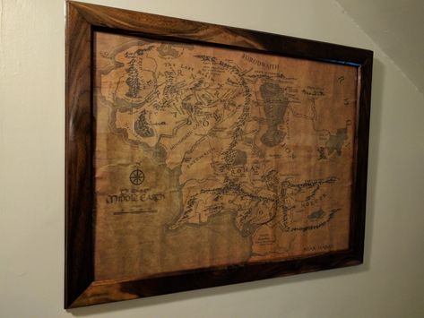 This picture frame was customized to fit a map of middle earth from Lord of The Rings. Walnut frame. Prices very per size and style of frame. Lotr Map Wallpaper, Lord Of The Rings Map, Shire Map Middle Earth, Map On Wall, Middle Earth Map High Resolution, Middle Earth Map, Game Of Thrones Map World Framed, Deco Marine, Framed Map