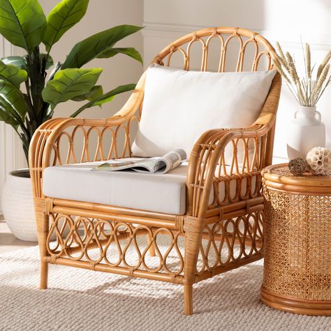 Seize the leisure of paradise in your own space with the stunning Reina arm chair. Made in Indonesia, this bohemian piece is beautifully handcrafted from natural rattan by skilled artisans. Its round backrest flows around the frame and forms sloping armrests to encourage carefree relaxation. The Reina will arrive fully assembled and is fitted with removable cushions padded with supportive foam and upholstered in sumptuous fabric. Presenting a gorgeous openwork design, the Reina arm chair brings exotic artistry to any setting.Disclaimer: Rattan is a product of nature and may have variations in areas such as, but not limited to, color, pattern, grain and texture. The hair-like strands of rattan/rattan-fiber are common due to the nature of the material. White Rattan Furniture, Indoor Rattan Furniture, Coastal Bedroom Furniture, Chaise Lounge Indoor, Tropical Furniture, Rattan Ottoman, Rattan Dining Table, Sunroom Furniture, Wicker Chaise Lounge