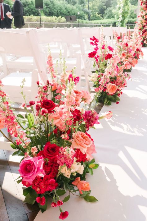 Romantic Spring Garden-inspired Wedding Aisle Markers with Vibrant Pink-hues Blooms | floral aisle markers, floral ceremony ideas, colorful aisle flower arrangement, aisle decor outdoor wedding, ceremony aisle ideas, wedding aisle marker ideas, wedding ceremony ideas, wedding ceremony decorations, wedding inspo, wedding ceremony setup, wedding ceremonial ideas, wedding ceremony decorations, wedding ceremony backdrops, wedding flower inspiration, outdoor wedding ceremony | #weddingflowers Aisle Arrangements Wedding, Aisle Flowers Wedding Walkways, Ceremony Aisle Decor Outdoor, Aisle Decor Outdoor, Wedding Aisle Markers, Aisle Greenery, Outdoor Aisle, Wedding Aisle Decorations Outdoor, Aisle Arrangements